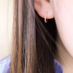 small diamond huggies on ear