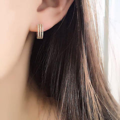 triple row diamond huggies on ear