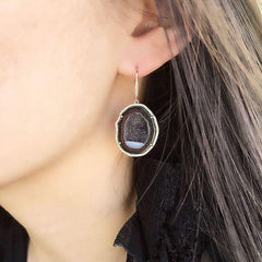 geode earrings on ear