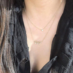 leaf necklace on neck