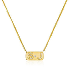 personalized necklace with single diamond and diamond initials in yellow gold