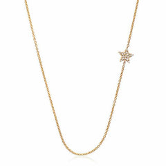 sideways star necklace with diamonds in yellow gold