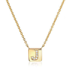 petite initial tag necklace with diamonds in yellow gold