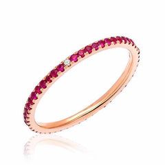 Ruby eternity band with compass point diamonds in rose gold