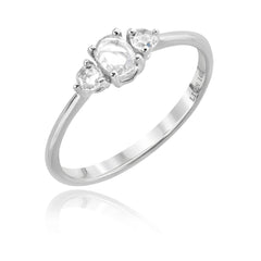 three rose cut diamonds on a white gold band. Center stone is oval, and 2 round side stones
