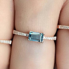 rose gold diamond band with emerald cut london blue topaz