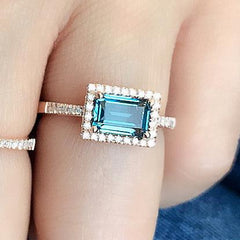 rose gold diamond band with emerald cut london blue topaz