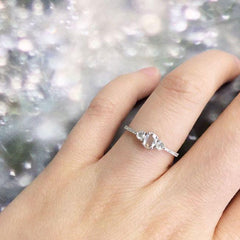 heirloom rose cut oval and round three diamond band on hand