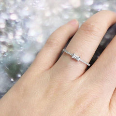 heirloom baguette center halfway diamond band on hand